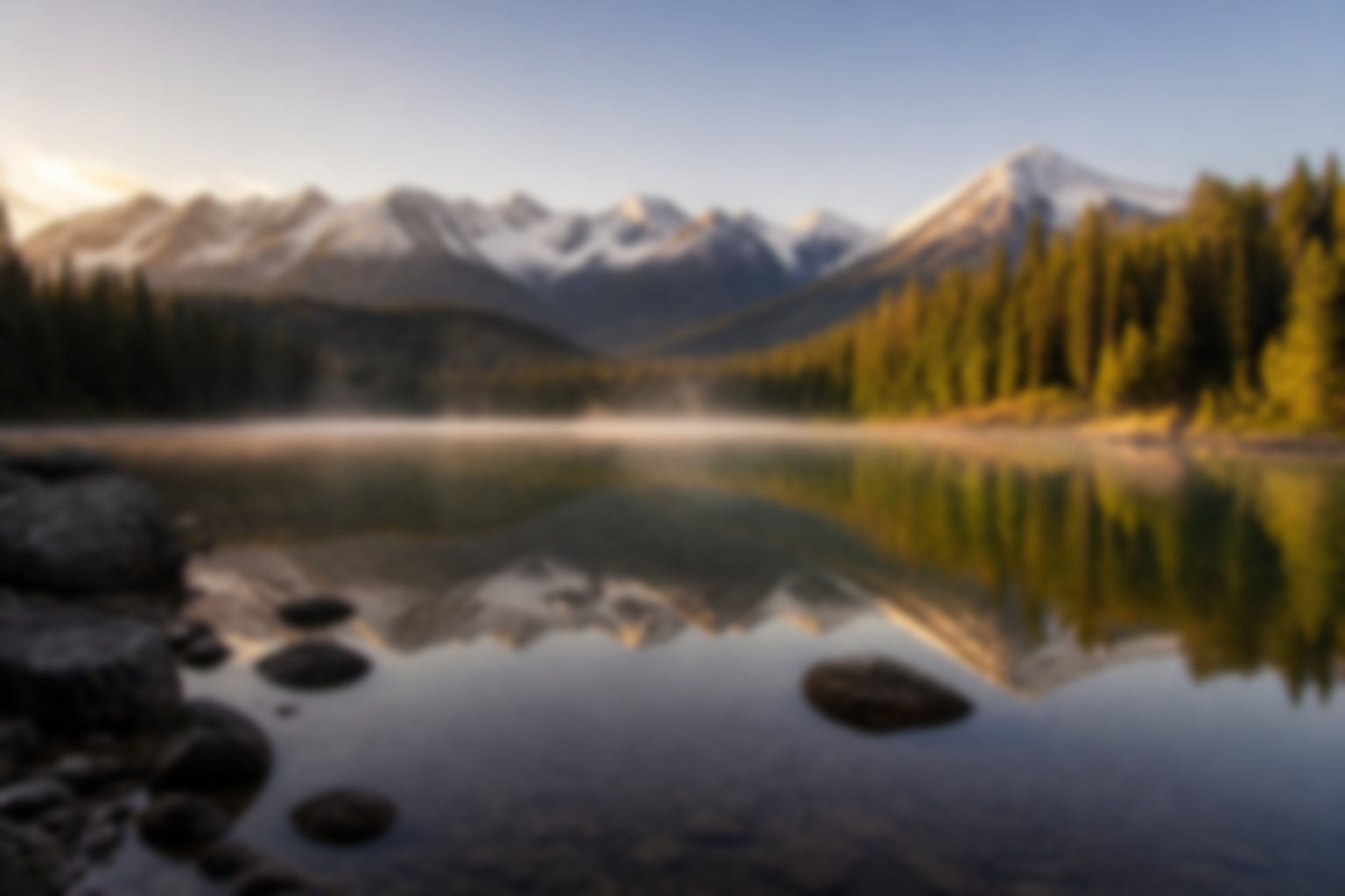 The same lake photo with a Gaussian blur: soft smeared edges and no block structure